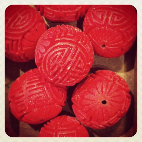 Carved wooden beads, made to look like cinnabar.